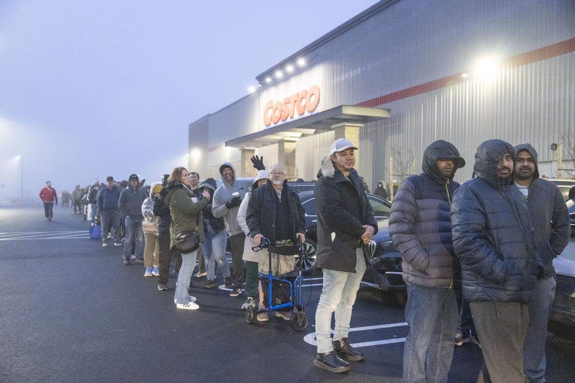Customers wait in line at 7 a.m. for the grand opening at the Costco in Roseville at Baseline Road on Friday.
