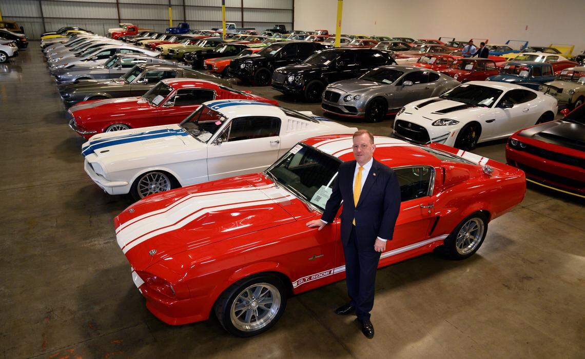 McGregor Scott, U.S. attorney, stands next to a 1967 Ford Shelby GT 500 at a warehouse in Woodland on Sept. 16, 2019. The car was one of 150 auctioned after they were seized by the government in connection with a massive Ponzi scheme out of Benicia.