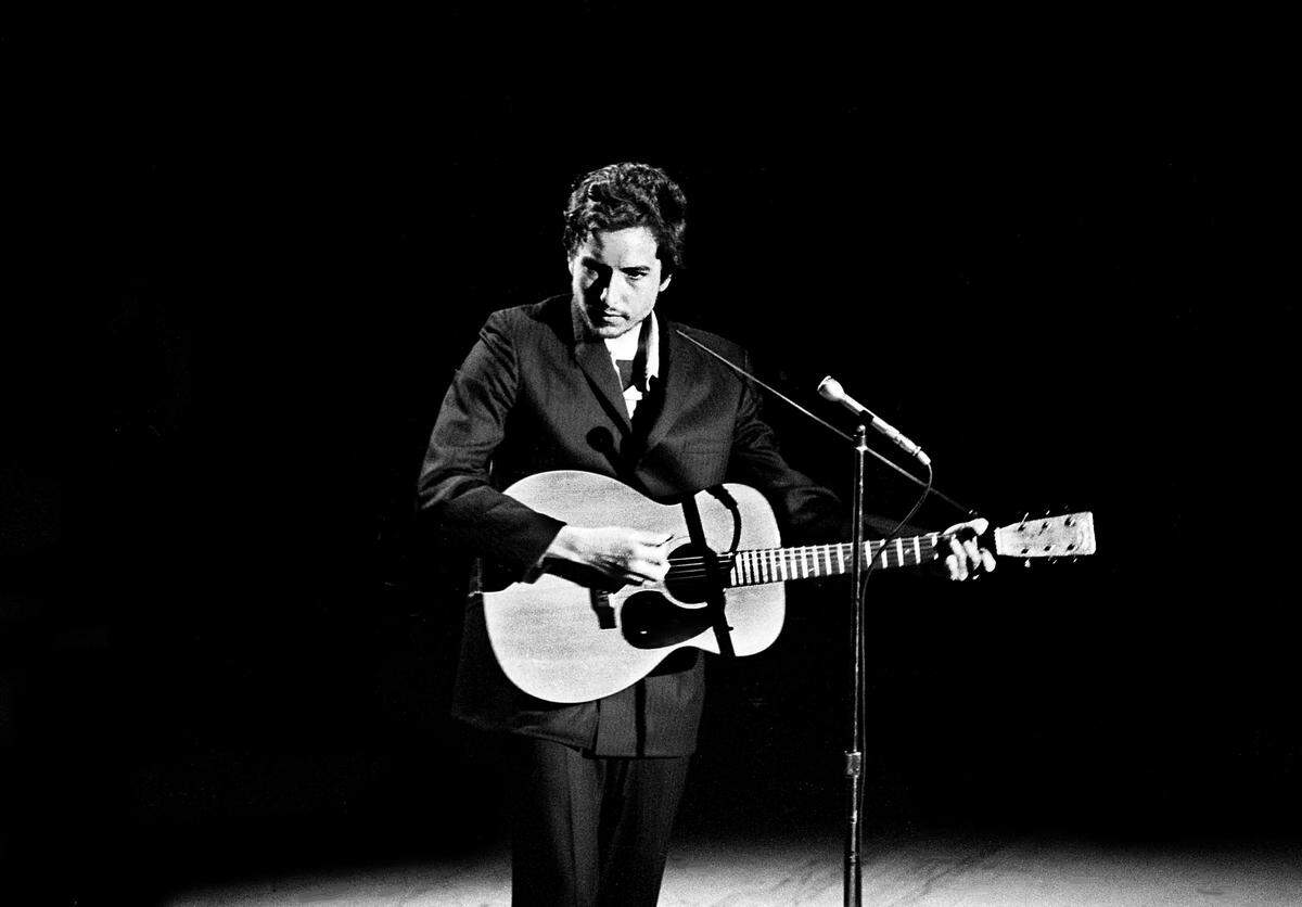 Bob Dylan sings “I Threw It All Away” during taping for the first episode of the Johnny Cash Show at the Ryman Auditorium in 1969.