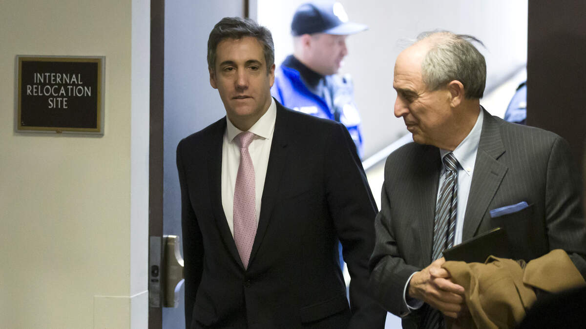 Michael Cohen, left, President Donald Trump’s former lawyer, arrives to testify before a closed door hearing of the Senate Intelligence Committee accompanied by his lawyer Lanny Davis of Washington, on Capitol Hill, Tuesday, Feb. 26, 2019, in Washington.