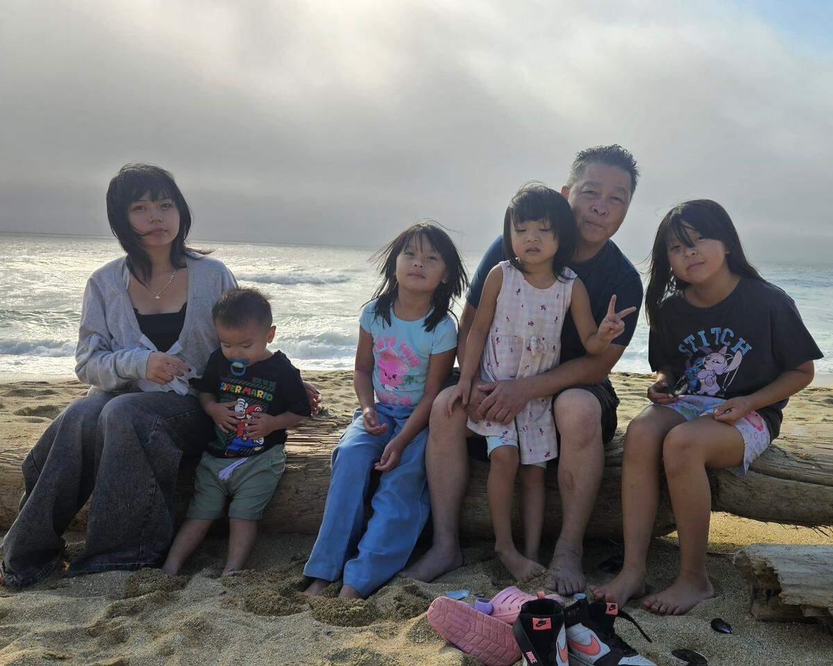 Bee Lao poses for a family photo. A driver fatally struck Lao while he was walking on Marysville Boulevard and Del Paso Road. He and Stella Xiong had five children together: Sophia, now 14, Benjamin, now 2, Priscilla, now 6, Alexandra, now 5, and Isabella, now 11.