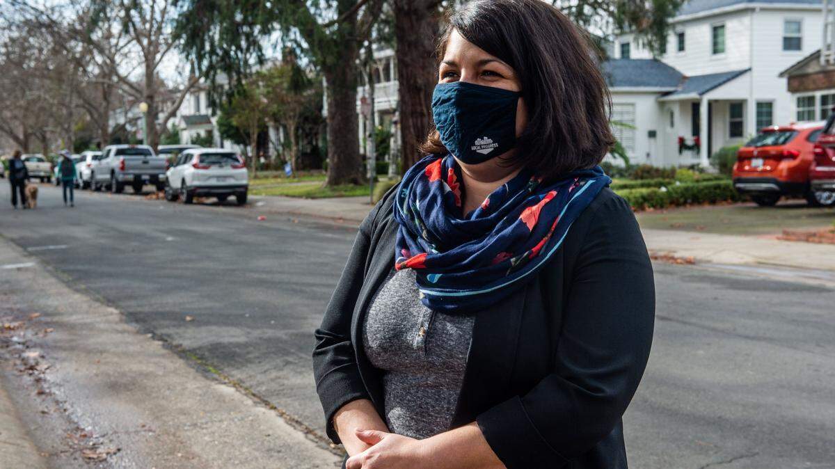 City Councilwoman Katie Valenzuela stands in front of homes in Sacramento’s Land Park neighborhood Thursday, Jan. 7, 2021. Neighborhood group leaders in Land Park and Elmhurst are fighting a city plan that would allow housing with up to four units to be built anywhere in the city.