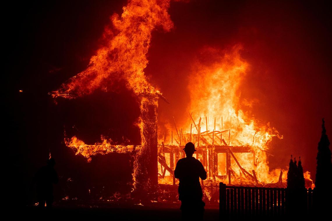 A home burns as the Camp Fire rages through Paradise, Calif., on Thursday, Nov. 8, 2018.