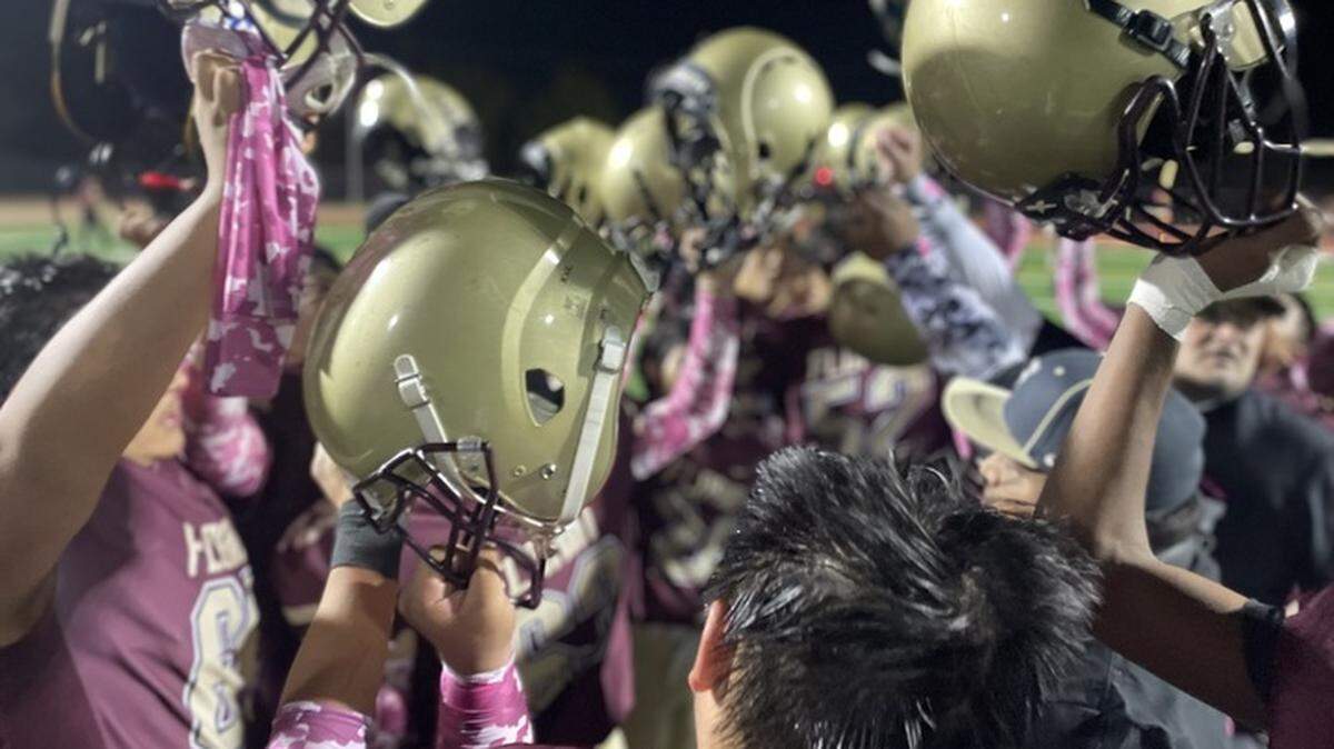 Florin High School varsity football hold their helmets to the sky one final time during the 2023 season. Low roster numbers have led to the cancellation of the varsity football seasons at Florin and Valley high schools of the Elk Grove Unified School District.