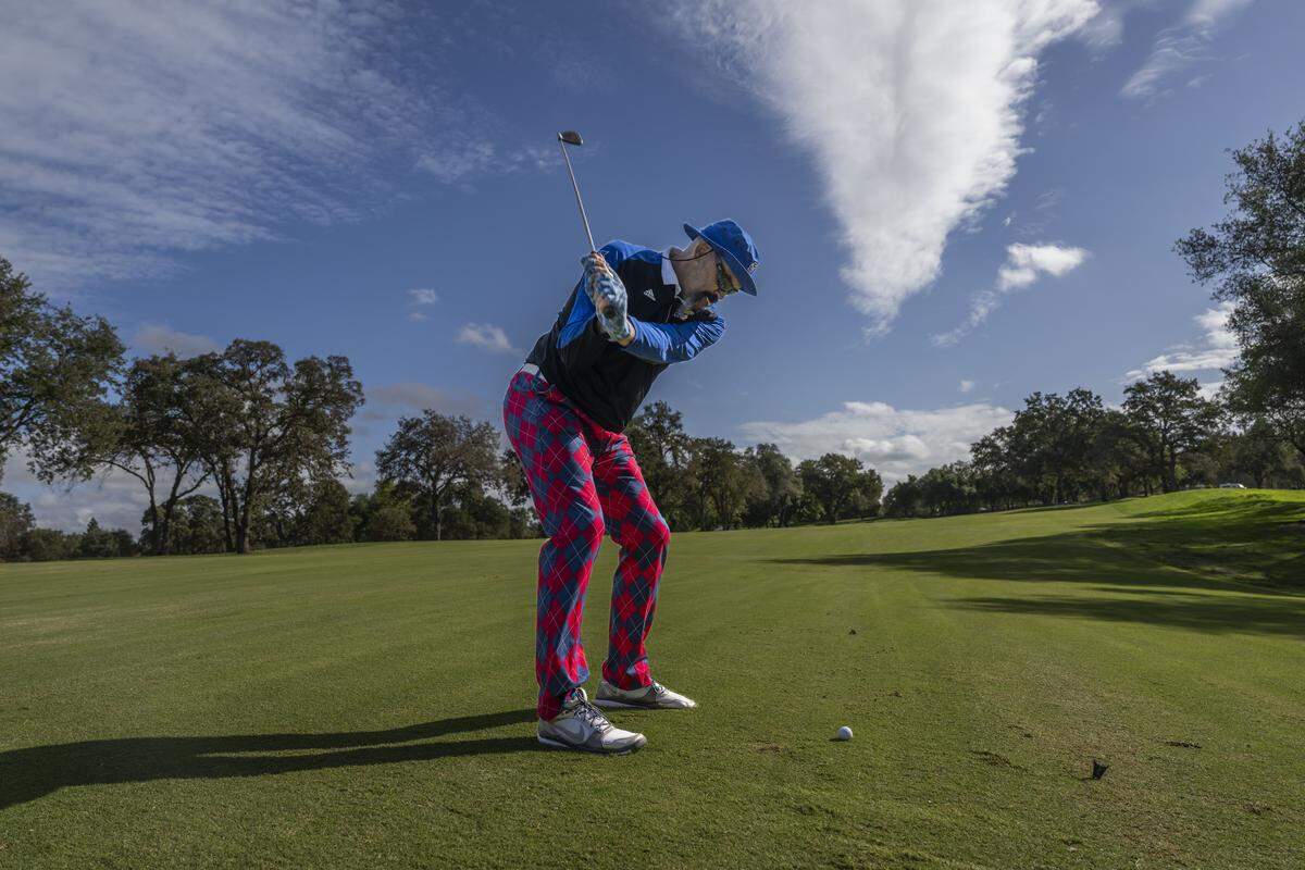 Former Sacramento Kings player Scot Pollard swings the ball on the fairway during the Phil Oates Celebrity Golf Classic in Granite Bay on Monday. Pollard received a life-saving heart transplant in 2024. 