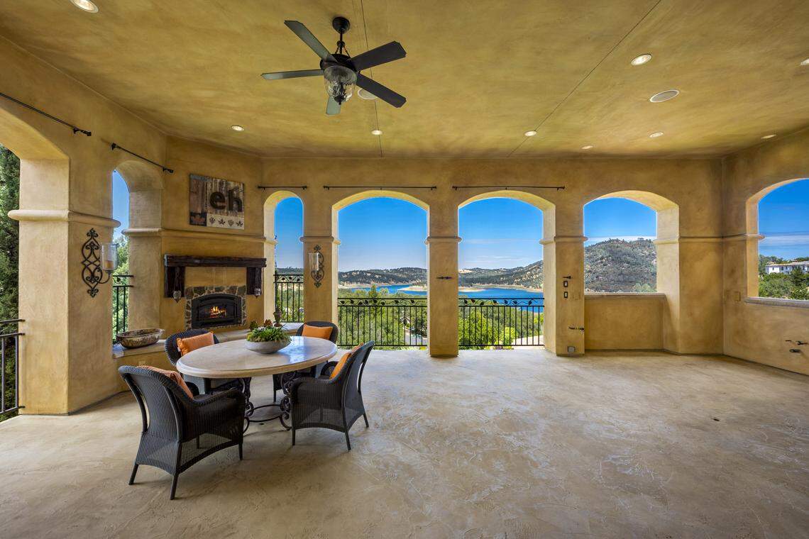 Expansive covered loggia takes full advantage of panoramic Folsom Lake vistas—perfect for sunset entertaining and outdoor dining.