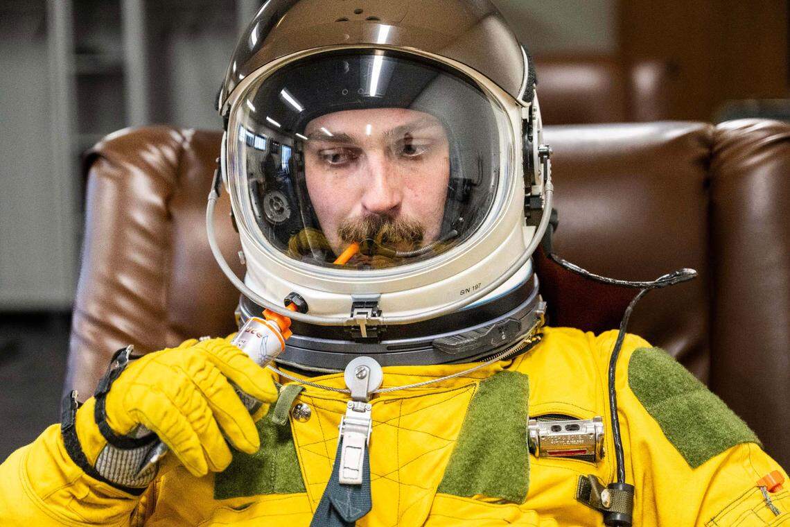 Capt. Blitz demonstrates at Beale Air Force Base earlier this month how he eats while while wearing his pressure suit as he flies the U-2.