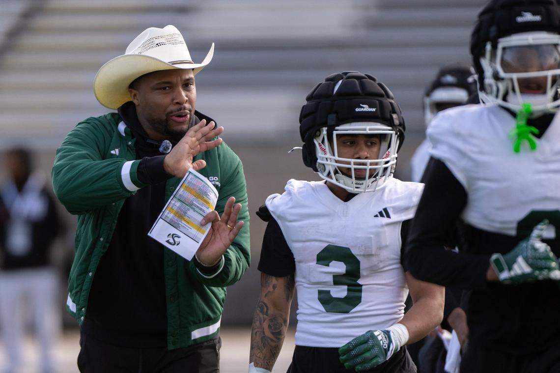 Sacramento State football coach Brennan Marion leads the team during the first day spring practice on campus last month.