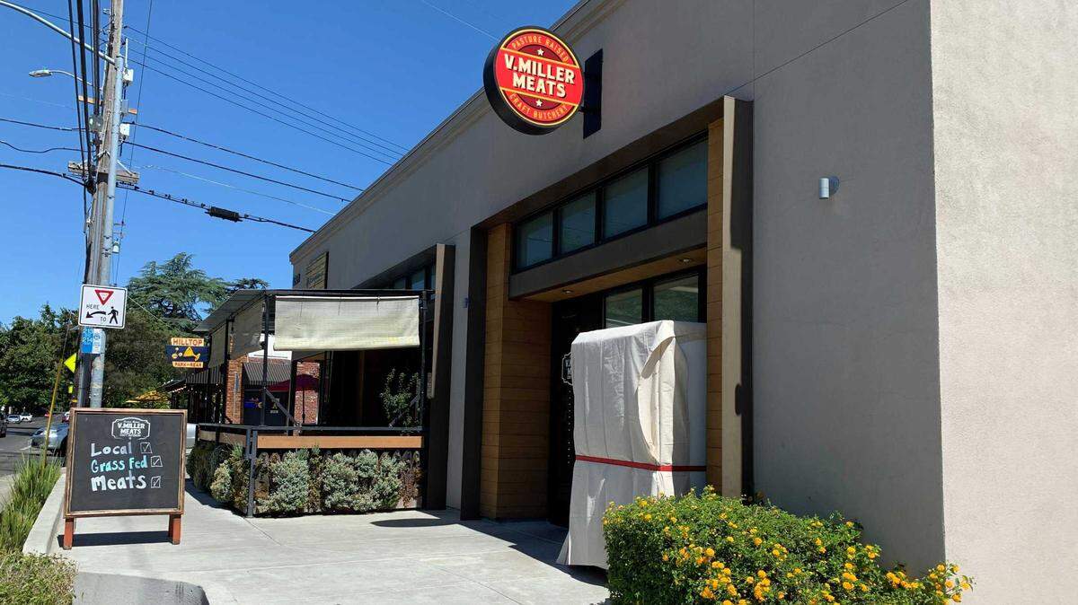 A 24-hour meat vending machine is covered outside V. Miller Meats on Saturday, June 18, 2022. The East Sacramento butcher shop had the opening of its machine delayed by county officials.