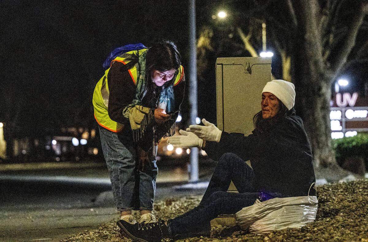 Evelynn Dominguez, with the nonprofit Community HealthWorks, interviews Lory Yvonnegrubb, who has been homeless for five years, during the Sacramento County Point-in-Time Count on Monday. Yvonnegrubb requested a locker with a key for her property. The survey is conducted every two years to measure the number and demographics of the county's homeless population. 