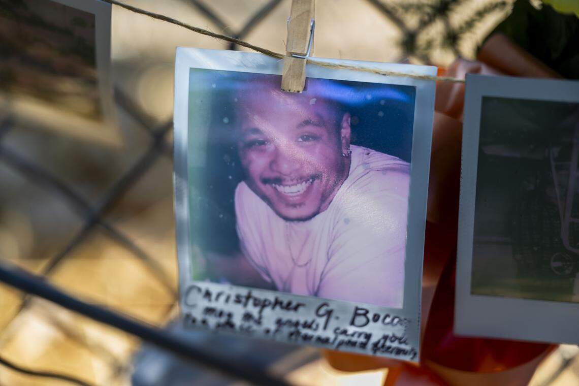 A photograph of Christopher Bocog, 45, who was one of seven men that died after a Devastating Pyrotechnics fire in Esparto in early July, hangs at a memorial near the site on Thursday.