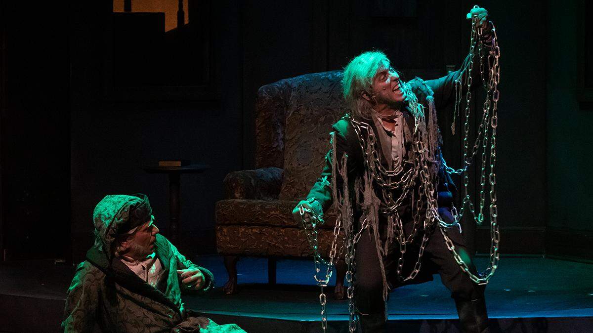Actors Matt K. Miller and Eric Wheeler play in Sacramento Theatre Co.’s “A Christmas Carol.”