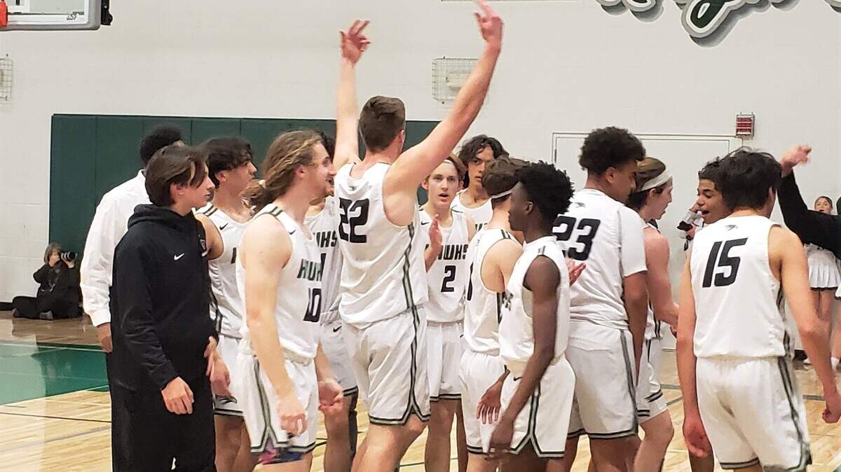 The Liberty Ranch boys’ basketball team celebrates a win over Union Mine in late February.