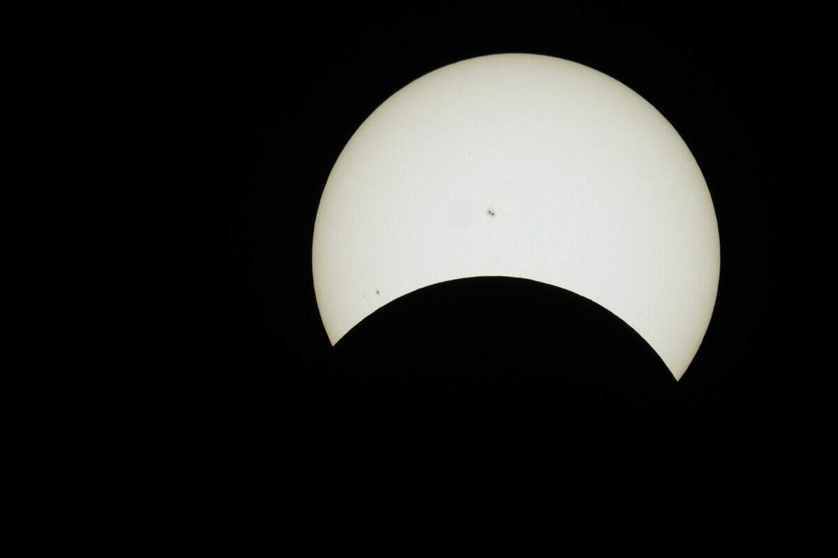 The solar eclipse hits its maximum coverage as viewed from Sacramento at the Museum of Science and Curiosity on Monday, April 8, 2024.