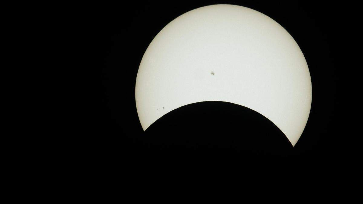 The solar eclipse hits its maximum coverage as viewed from Sacramento at the Museum of Science and Curiosity on Monday.
