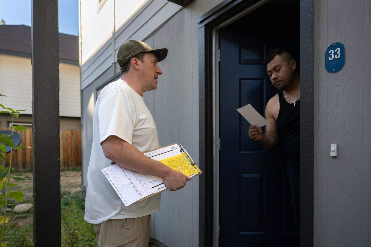 South Lake Tahoe City Councilman Scott Robbins knocks on doors in August to share information about Measure N, a proposed tax on homes that sit empty most of the year.