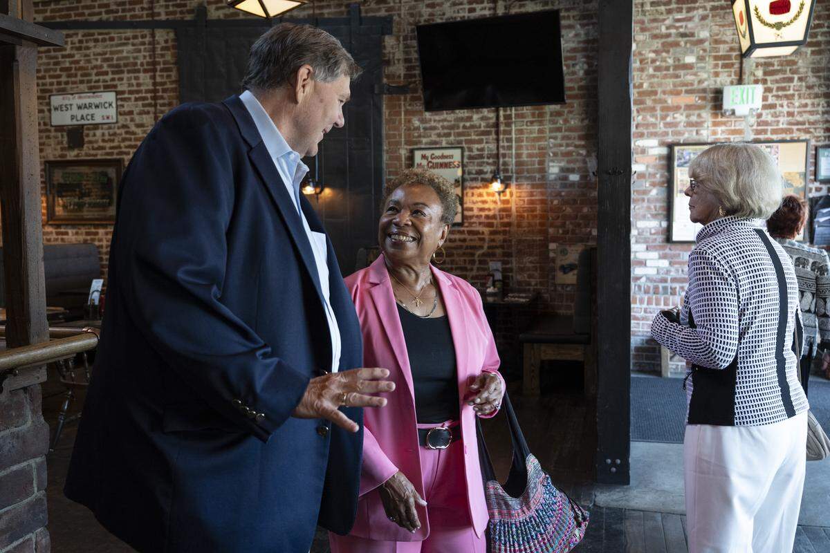 Former state legislator and former chairman of the California Republican Party Jim Brulte, left, talks with Barbara Lee, who is the current mayor of Oakland and a former Democratic state legislator, during a reunion for the California Assembly class of 1990 at Fox & Goose in Sacramento on Wednesday.