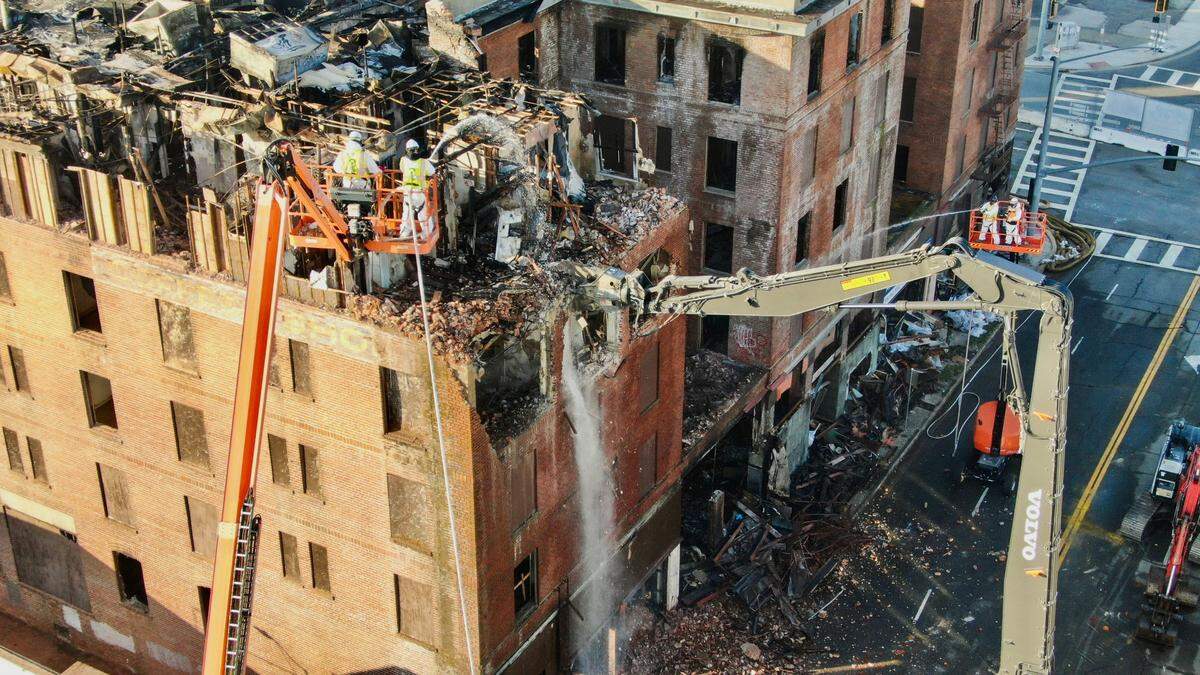 Workers demolish the Hotel Marysville in the city’s downtown on Wednesday, Dec. 11, 2024.