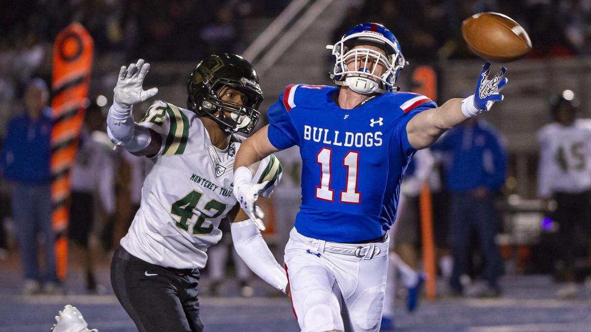 Folsom Bulldogs Zack Cottrell (11), cant make the catch in front of Monterey Trail Mustangs Marcus Jones Jr. (42), as the Folsom High School Bulldogs host the Monterey Trail Mustangs in their play off game Friday, November 22, 2019.