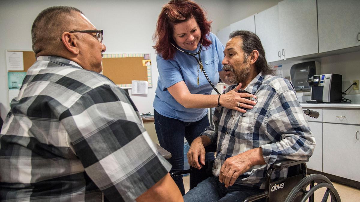 Francisco Gonzalez, a Sacramento homeless man, is checked by Rennie Jemmings, RN, as Daniel Salazar, a case manager with WellSpace Health, helps translate on Friday, May 4, 2018, at a Volunteers of America office.