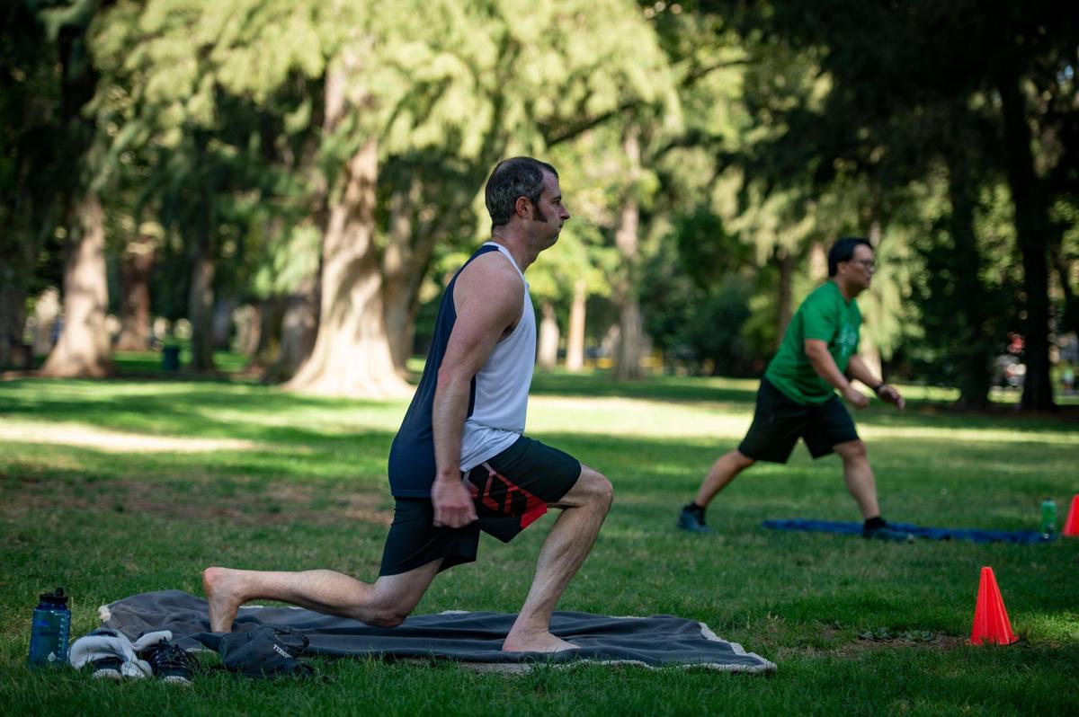 Brett Owens of Sacramento follows fitness instructor Forest Vance at an outdoor fitness bootcamp, Friday, Aug. 14, 2020, at William Land Park in Sacramento. Gyms and fitness centers are currently closed due to the coronavirus pandemic causing many to turn to the outdoors for classes or making online content for their customers.