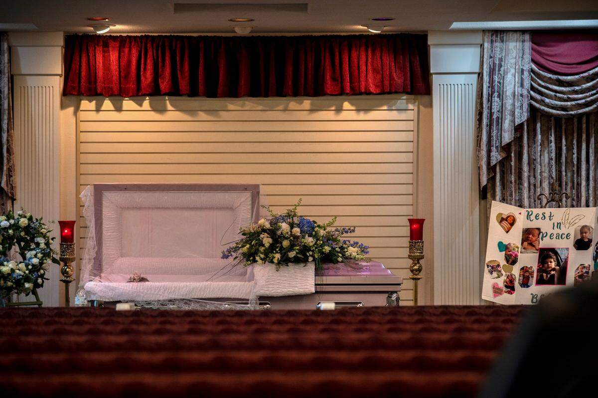 Isabel Delgadillo Martin, 7, wears a princess tiara as she is laid to rest in a pink coffin at her funeral at Sunset Lawn Chapel mortuary in Sacramento on Friday, Dec. 10, 2021. When her mother approached the coffin she wailed “I love you baby girl” over and over again. Isabel was shot and killed in November near Seavey Circle in the Upper Land Park neighborhood. The family had been homeless, in and out of motels and their car, for about a year, said Monica Delgadillo.