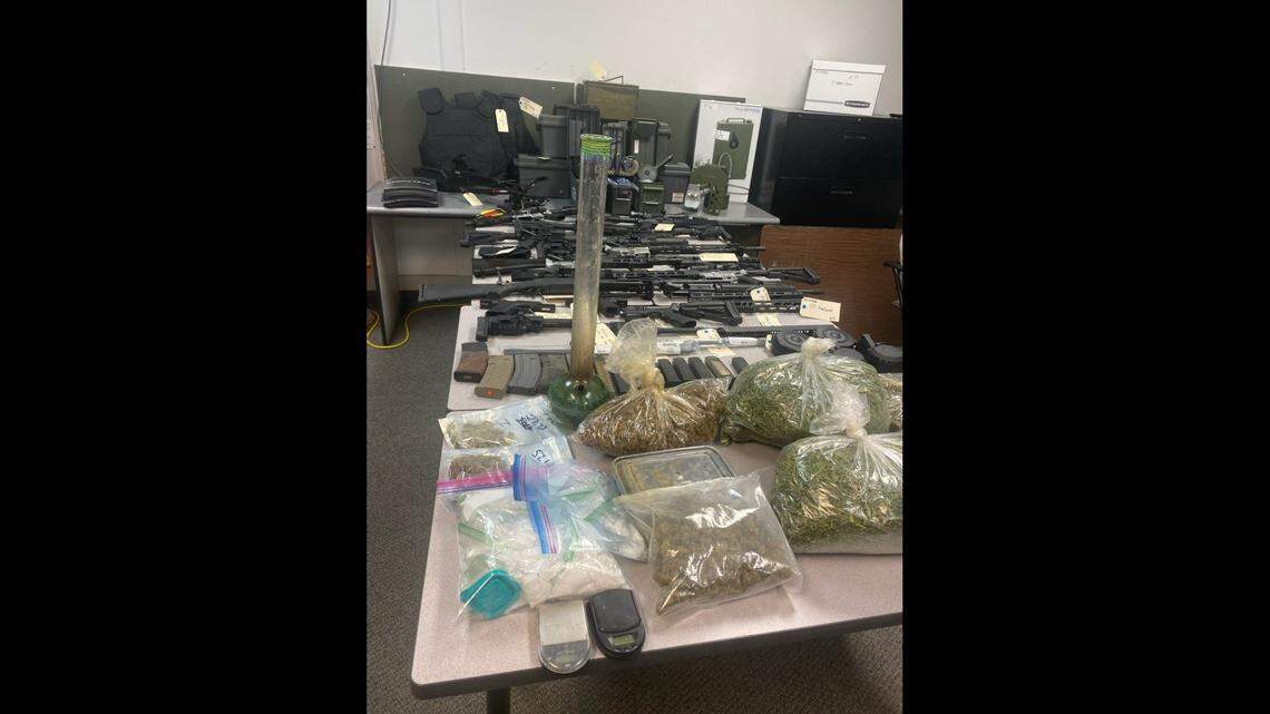 A wanted California man was found in Utah with a flamethrower, body armor, badges, numerous guns and thousands in cash, officials said.  (Photo from Emery County Sheriff’s Office)