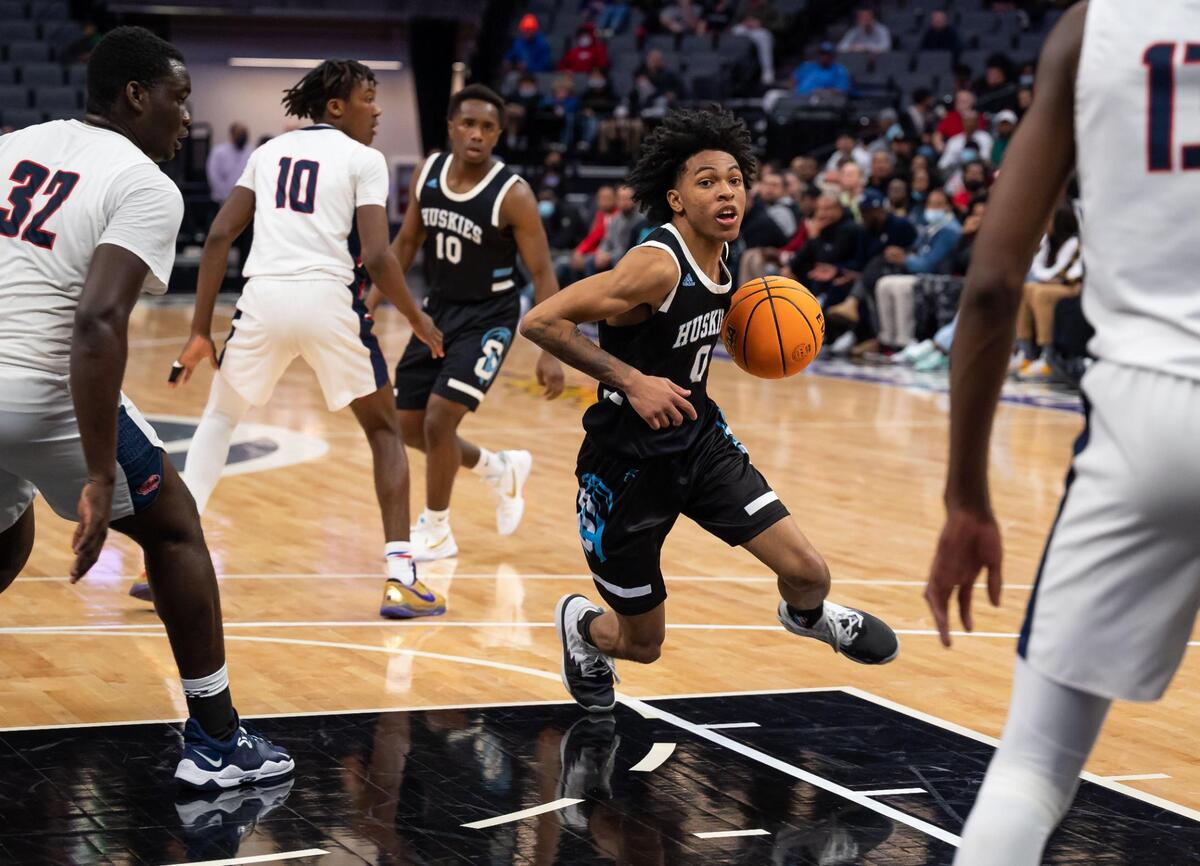 Sheldon Huskies’ Tyrice Daniels (0) dribbles towards the basket, flanked by Modesto Christian Crusaders’ Manasse Itete (32), left, and Prince Oseya (13) during the fourth period at the high school boys basketball Sac-Joaquin Section Division I championship game Saturday, Feb. 26, 2022, at Golden 1 Center in Sacramento. Modesto Christian beat Sheldon, 52-42, for the title.