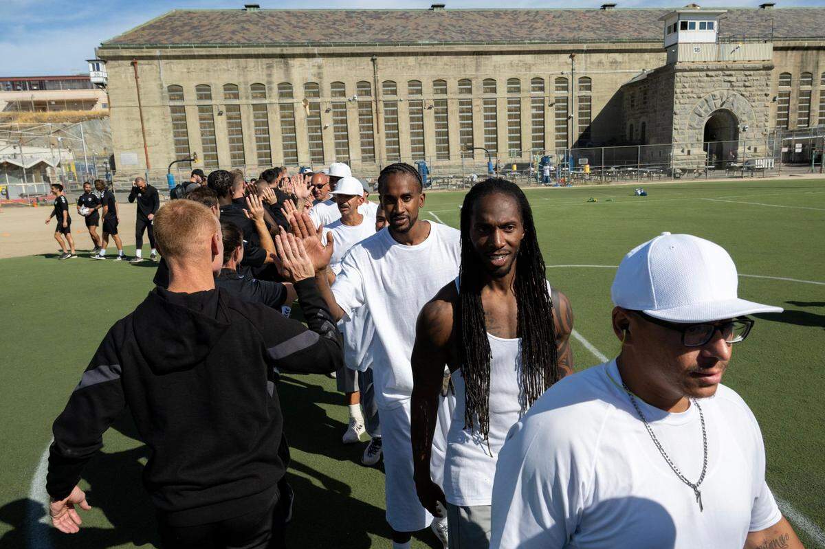 Sacramento Republic FC players high-five inmates at Folsom State Prison after a scrimmage on Tuesday.