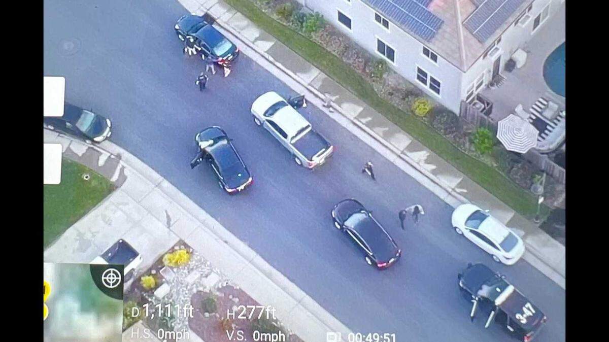 Captured in an image from police drone video, Rocklin Police are seen arresting a man suspected of being a streaker at Whitney Park on Wednesday, April 26, 2023.