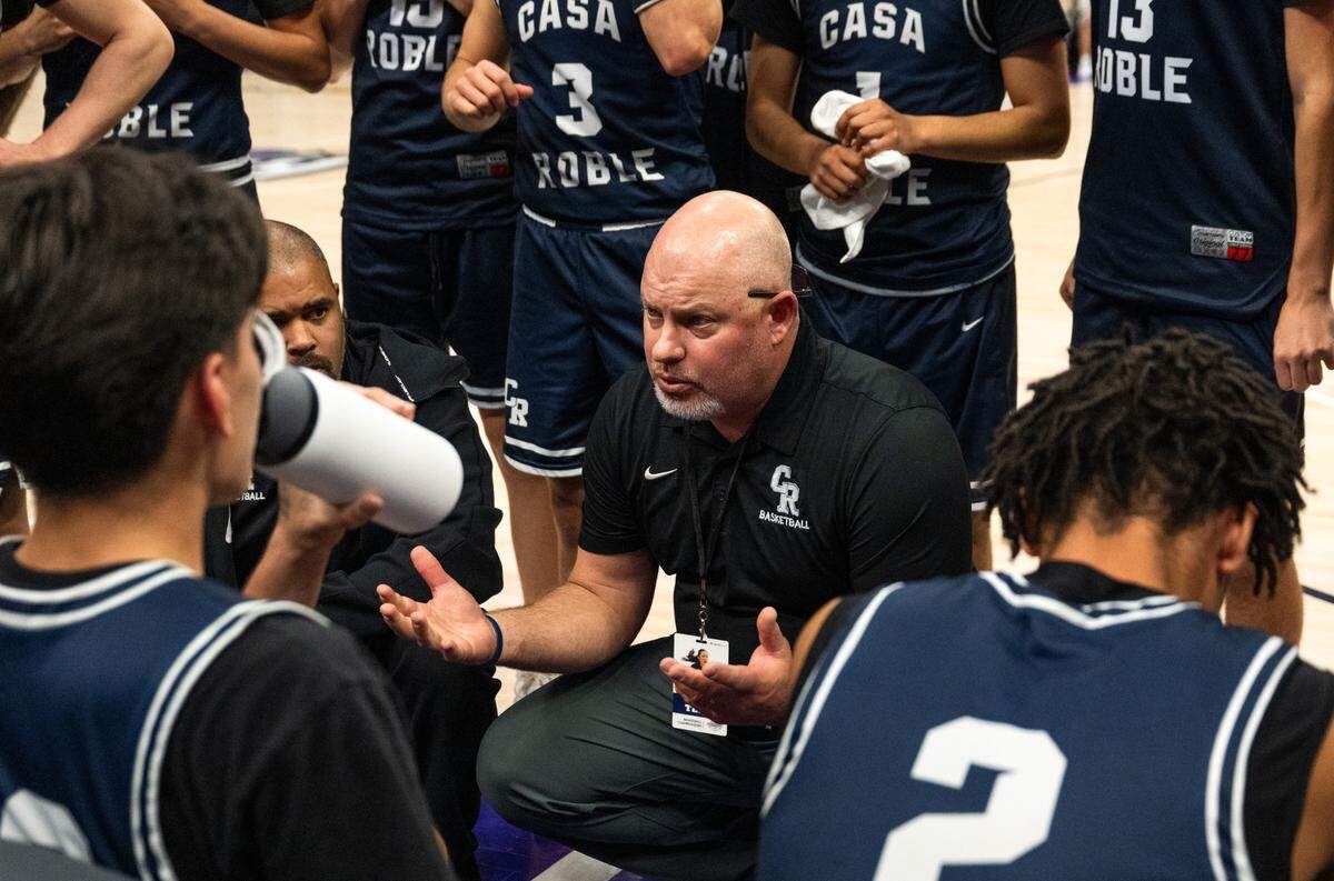 Casa Roble coach Nathan Gilbert motivates his team during a timeout against the Natomas Nighthawks in the first half of the CIF Sac-Joaquin Section Division IV boys basketball championship at Golden 1 Center on Thursday.