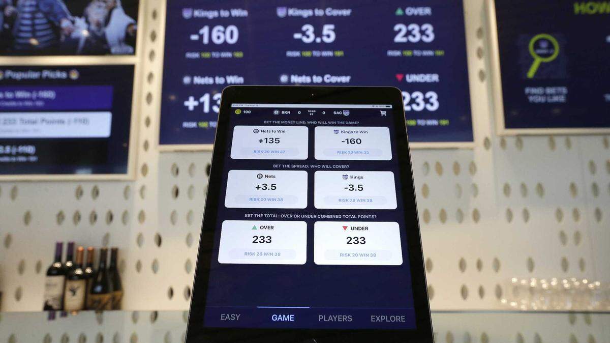 An iPad displays bet options that could be placed at the Golden 1 Center’s Skyloft Predictive Gaming Lounge in 2019. This November, California voters will decide whether to legalize online sports betting when they vote on Proposition 27, backed by FanDuel and DraftKings.