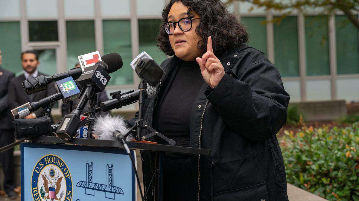 Giselle Garcia, a member of NorCal Resist, speaks at a news conference Friday denouncing recent ICE raids targeting Afghans, held in front of the John E. Moss Federal Building where Immigration and Customs Enforcement has its offices in downtown Sacramento.
