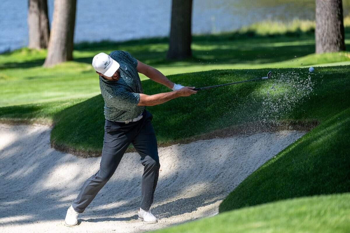The Kansas City Chiefs’ Travis Kelce hits out a sand trap onto the third hole green during the American Century Championship celebrity golf tournament at Edgewood Tahoe Resort in Stateline, Nev., on Friday, July 11, 2025.
