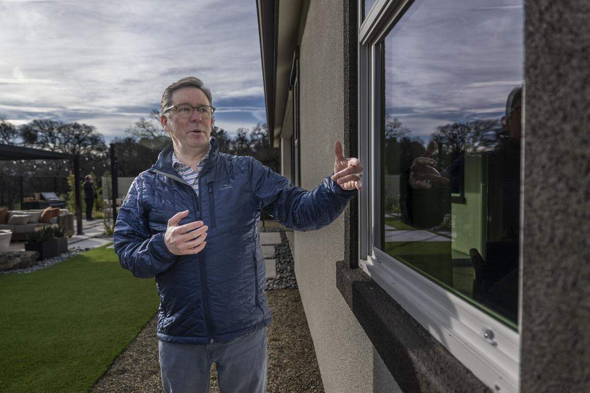 Roy Wright, CEO of the Insurance Institute for Business & Home Safety, discusses the safety importance of dual-pane windows in Northern California’s first Wildfire Prepared Neighborhood in Cameron Park on Wednesday. The windows, along with other features, make it harder for embers to enter the home during a wildfire.