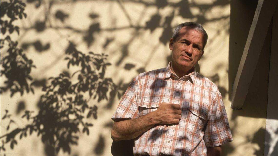 Nationally acclaimed Sacramento poet Dennis Schmitz at his home in 1994. Schmitz, author of many books of verse and the city of Sacramento’s first poet laureate, died Sept. 12 at 82.