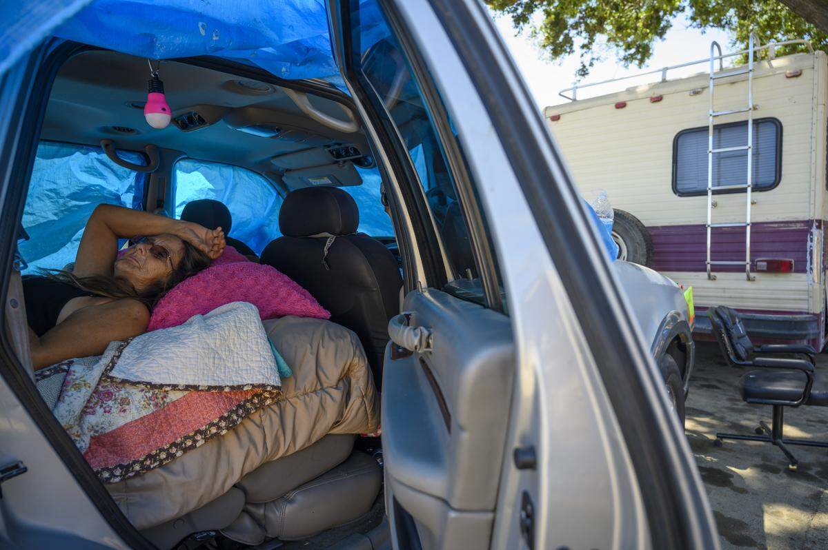 “I’ve got a headache,” says Gwen Mayse, 59, as she stresses in a van on Friday, Aug. 2, 2019 in Sacramento. She and her daughter were told they had to move their vehicles before Aug. 5th and they had no idea where they were going to go.