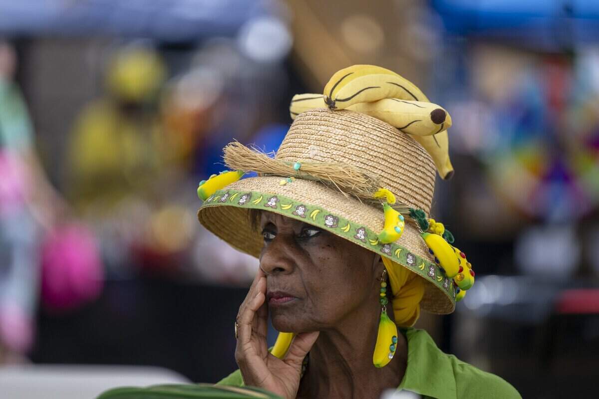 Ollie McDaniels waits for the entertainment to start at the Banana Festival in Land Park on Saturday, August. 15, 2026.