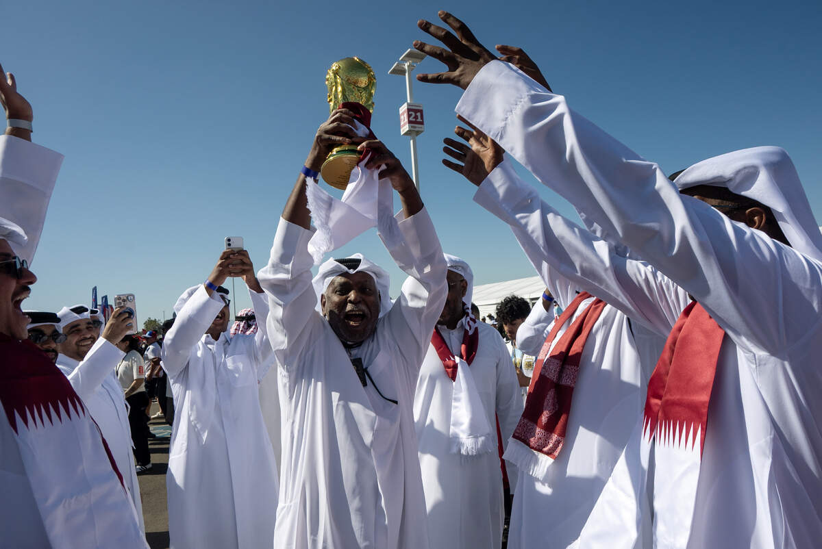 Qatar supporters celebrate and prepare for kickoff against Switzerland in the first World Cup group stage game in Santa Clara on Saturday, June 13. The nation’s team won its first point in World Cup play with a 1-1 tie.