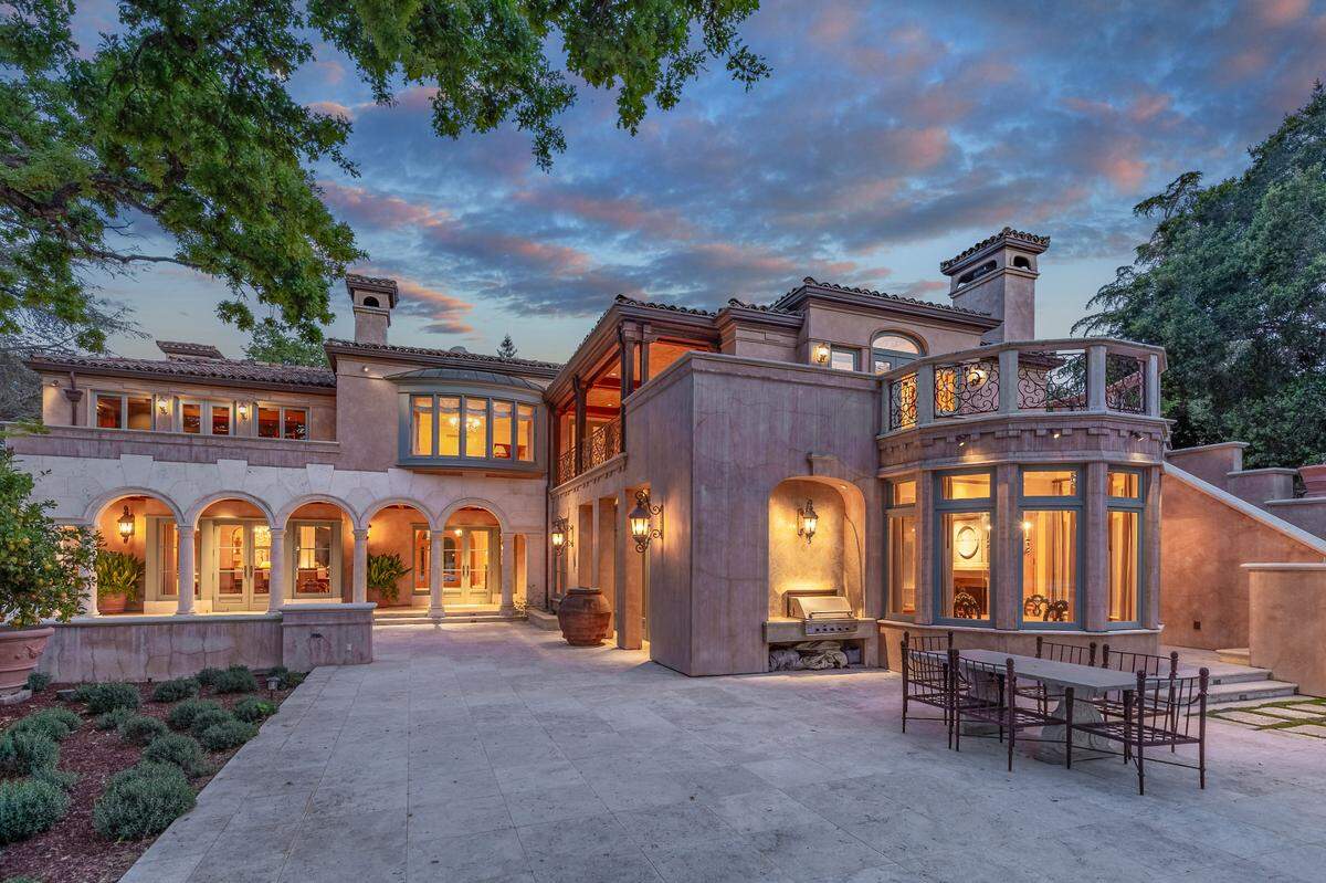 Indoor-outdoor living flows seamlessly across the villa’s 9,415-square-foot residence that features five-bedroom suites.