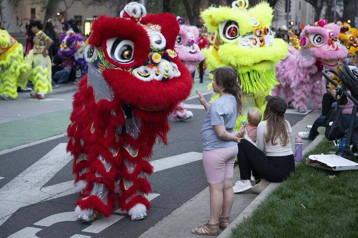 The Teng Fei Lion Dancers interact with the crowd during the City of Trees Parade in Sacramento on Saturday, Feb. 28, 2026.