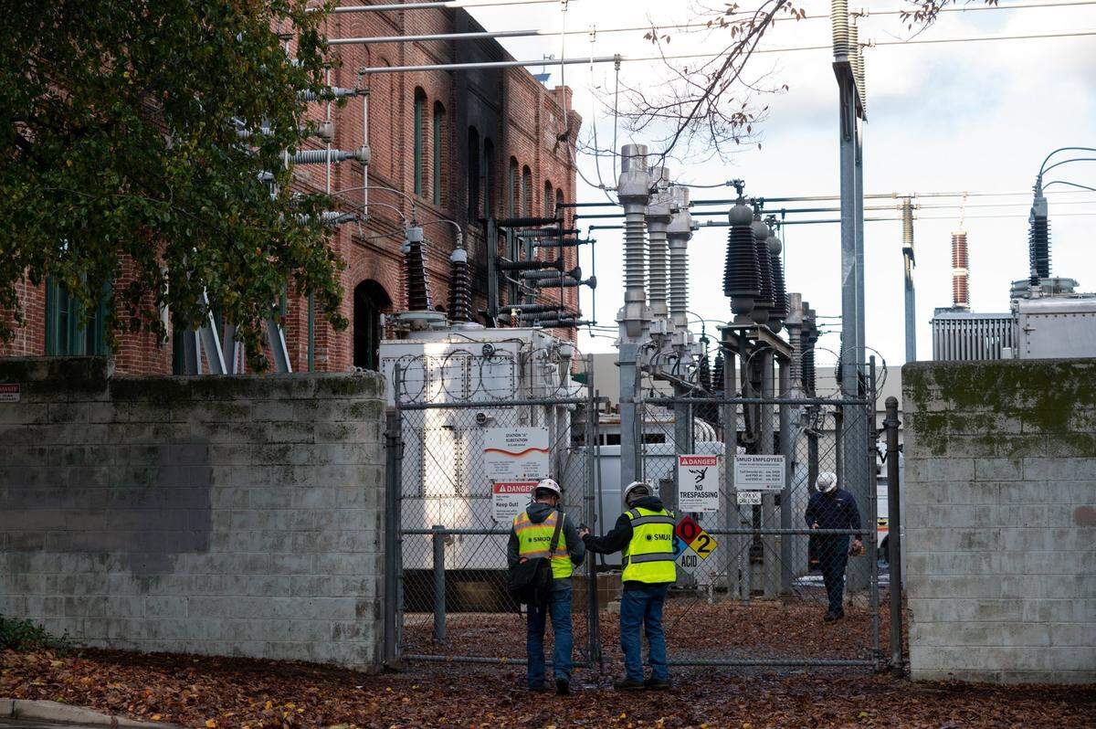 SMUD workers inspect the substation at 6th and H streets after a two-alarm fire caused significant damage to the substation and shut down electricity for about 1,300 SMUD customers in the downtown area on Tuesday, Dec. 14, 2021, in Sacramento.