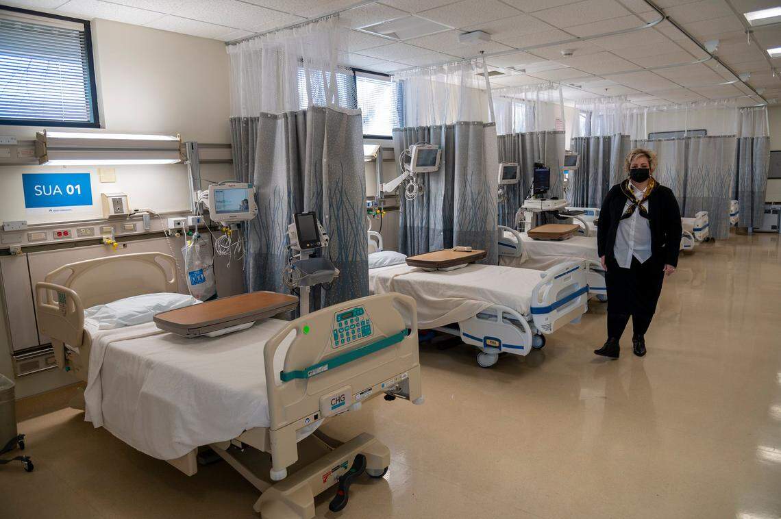 Trish Rodriguez, a senior vice president at Kaiser Permanente South Sacramento, tours a cardiac and telementry unit Friday that she said would open Monday for non-COVID patients. Kaiser worked with the state to provide temporary beds for non-COVID patients during the omnicron surge, expanding hospital capacity in the Sacramento region.