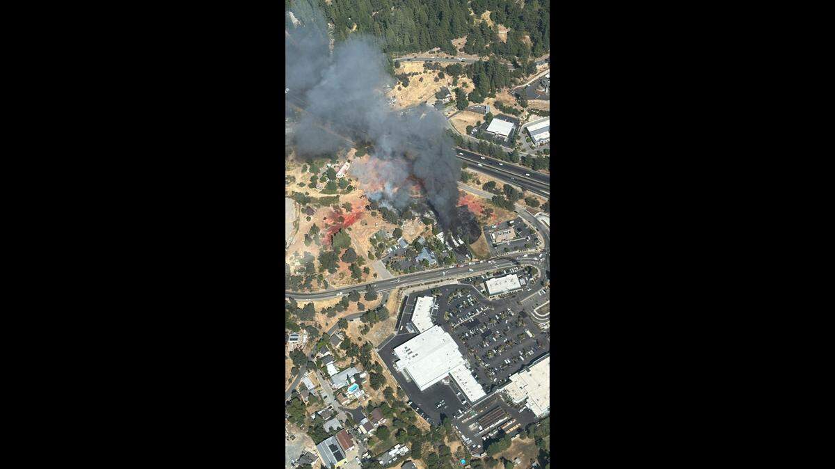A fire was burning Friday afternoon near businesses in Grass Valley along the Nevada City Highway. Evacuations were ordered.