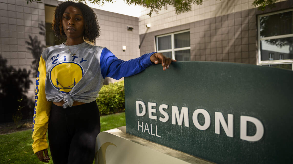 Jayda Preyer stands outside of her one month emergency housing dormitory, Desmond Hall at Sacramento State in Sacramento, Thursday, Sept. 25, 2019. Preyer has not yet secured housing after her one month stay at the emergency housing dormitories.
