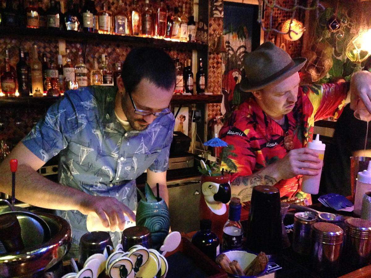 Jungle Bird bartenders mix a batch of Tiki drinks for the grand opening on Oct. 26, 2016.