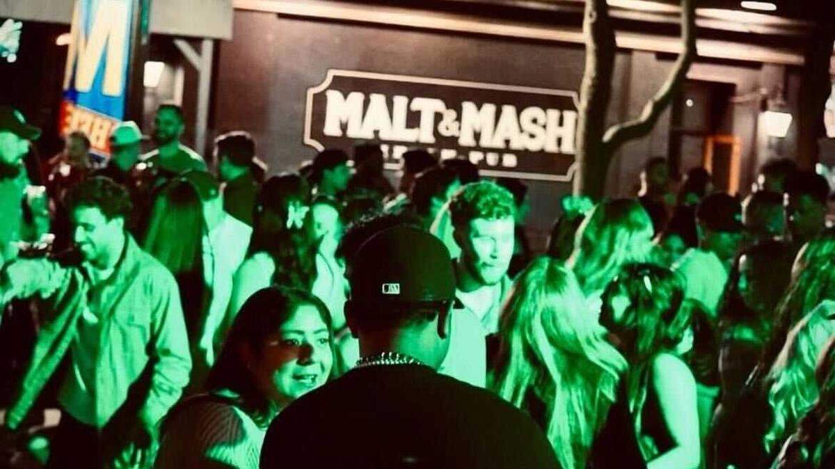 Guests once filled the patio at Malt and Mash, the now-closed Irish pub at 715 K St. in downtown Sacramento. The space will reopen in fall 2025 as Parkside Bar, featuring a national park theme and redesigned patio with a large swingset and expanded outdoor seating.