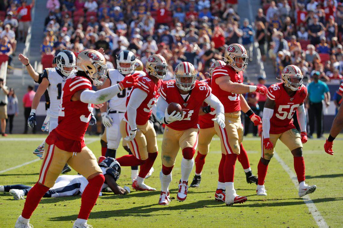 San Francisco 49ers defensive end Arik Armstead (91) recovers a fumble against the Los Angeles Rams during the first half of an NFL football game Sunday, Oct. 13, 2019, in Los Angeles. (AP Photo/John Locher)
