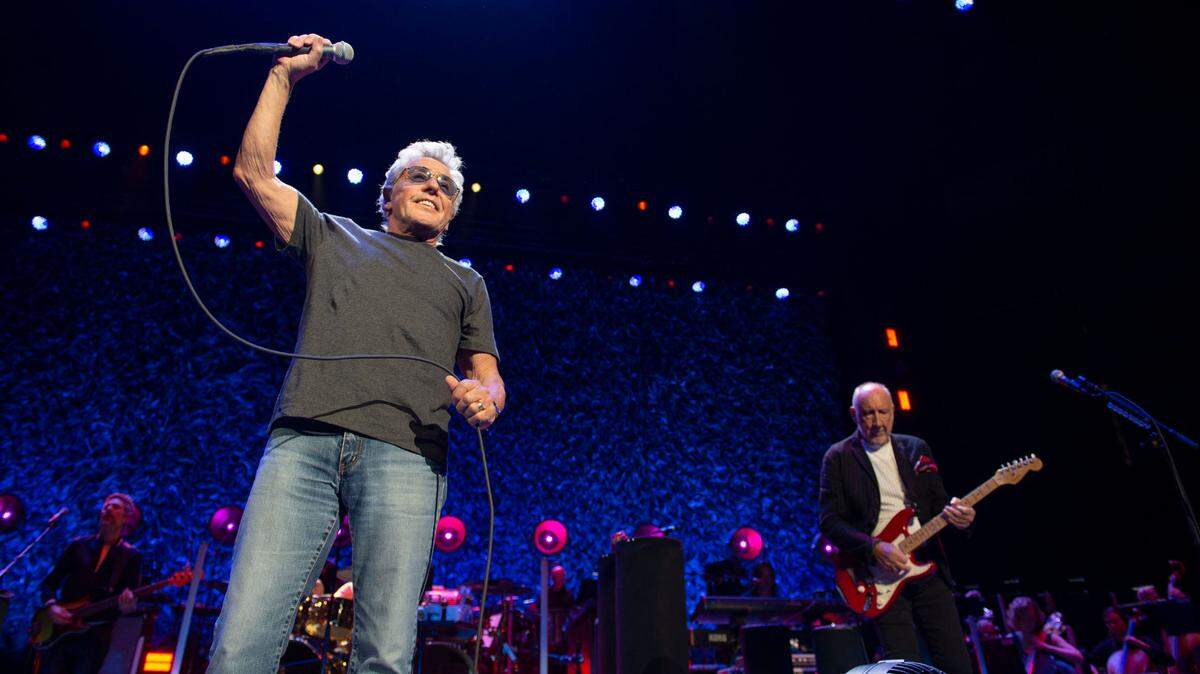 Roger Daltrey, left, and Pete Townshend of The Who finish a set while performing at the Golden 1 Center in Sacramento on their North American tour “The Who Hits Back!” on Wednesday night.