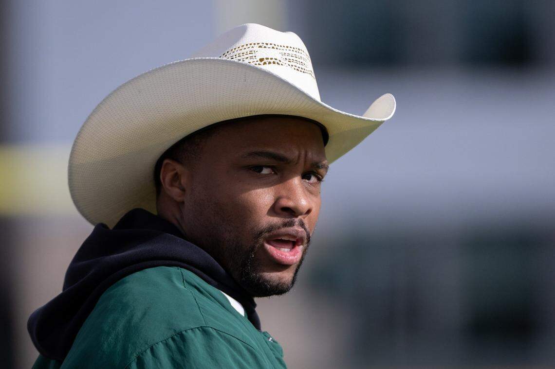 Football coach Brennan Marion leads the team during a spring practice at Sacramento State in March. 